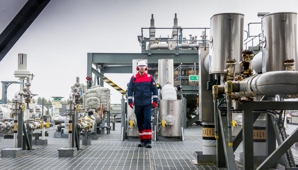 man on rig wearing safety uniform