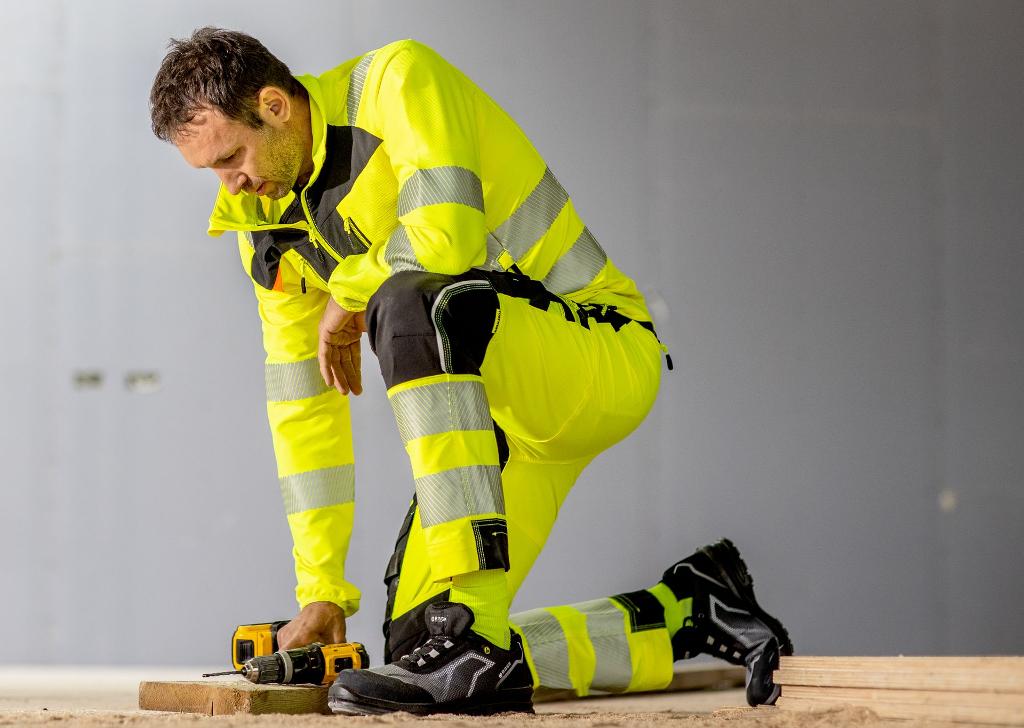 workwear man with drill and high visibility uniform