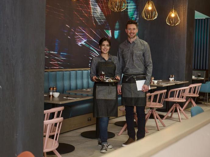 restaurant cafe waiter servers uniform with tray of drinks